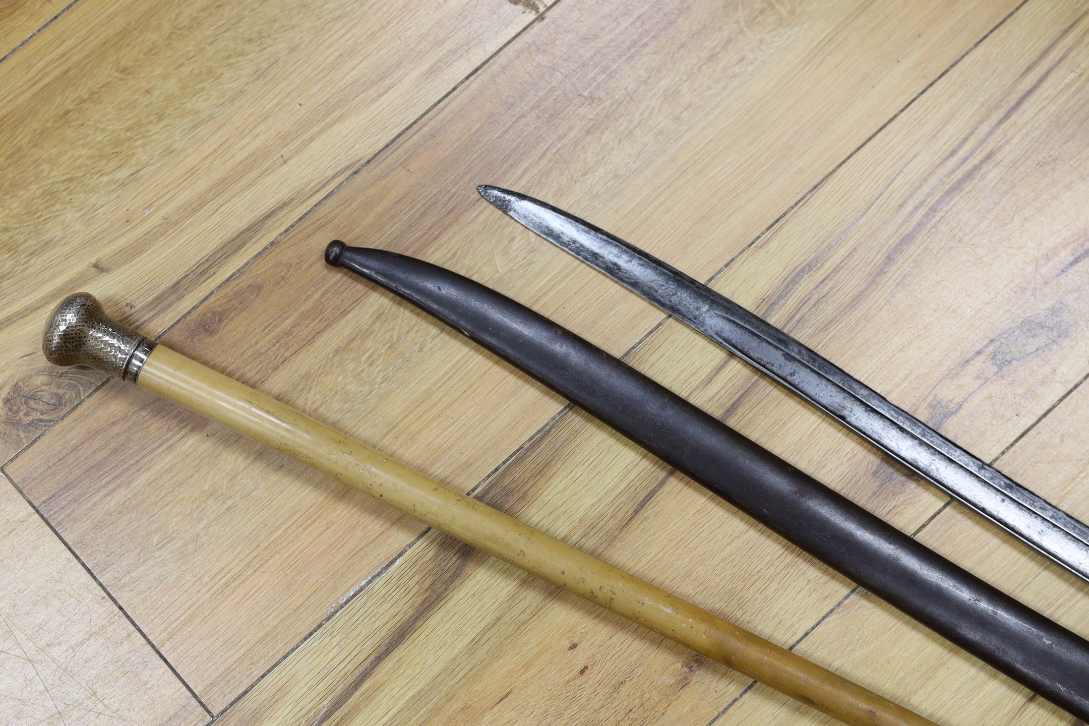 A silver mounted malacca walking cane together with a 19th century French bayonet